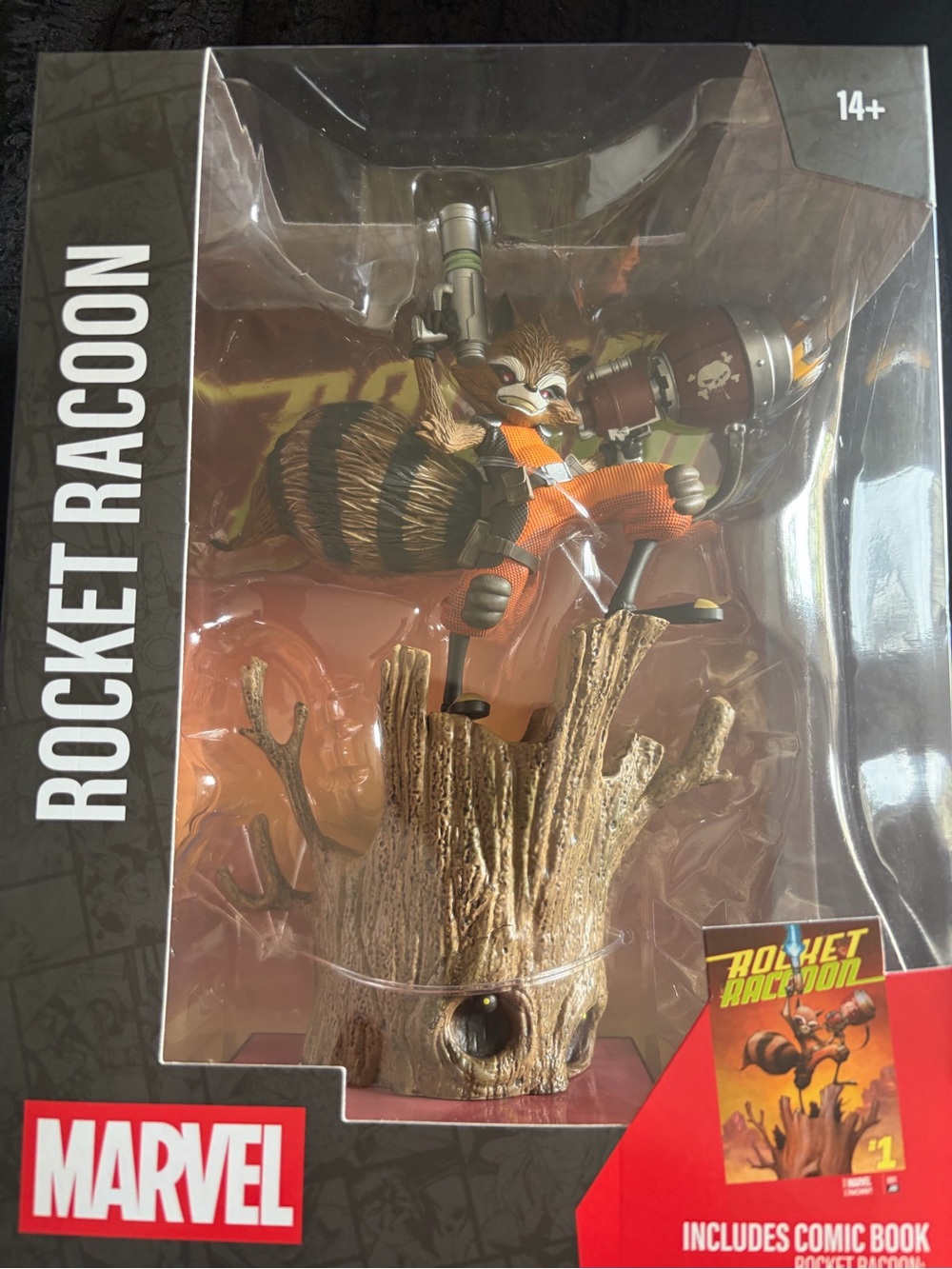 Marvel Rocket Raccoon Figure with Orange Outfit and Brown Tree Base